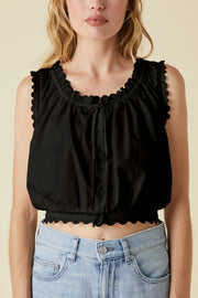 Image of model wearing the Le Jean Eyelet Cami front view close up