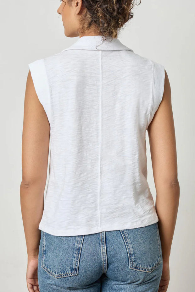 Image of model wearing the lilla p cap sleeve polo back view