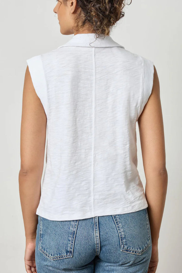 Image of model wearing the lilla p cap sleeve polo back view