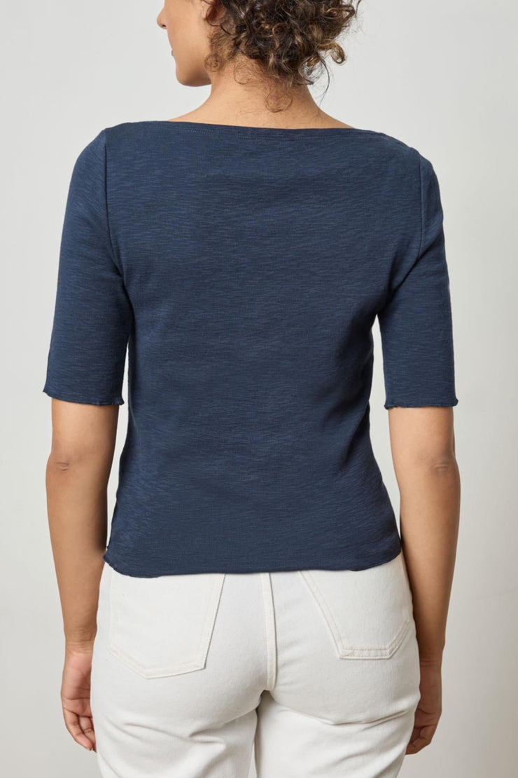 Image of model wearing the lilla p elbow sleeve boatneck back view