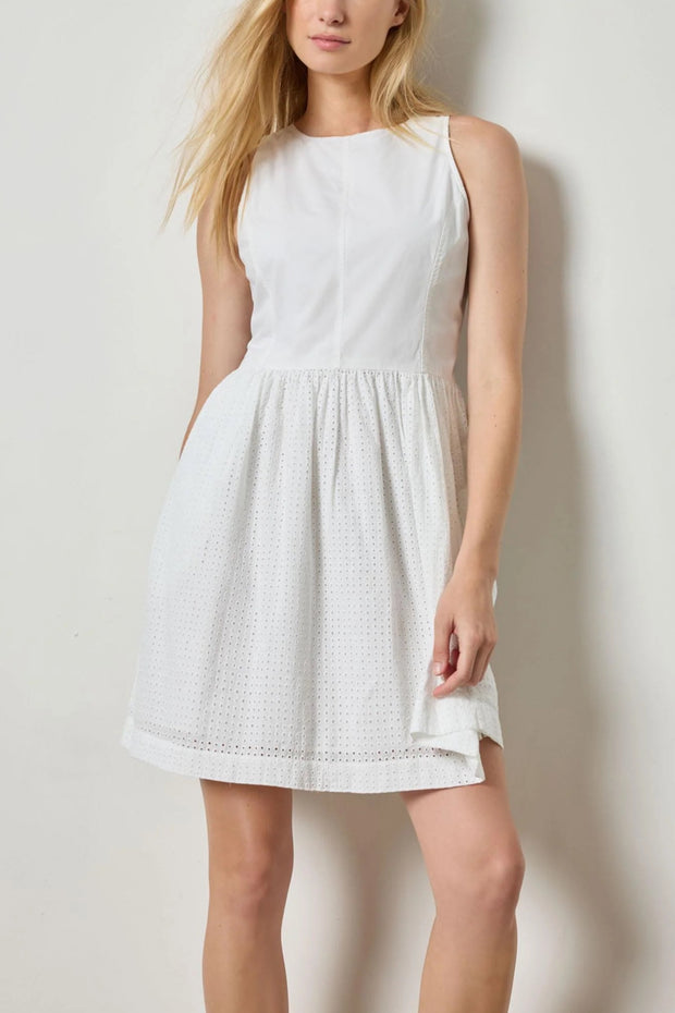 Image of model wearing the lilla p eyelet high neck mini dress front view