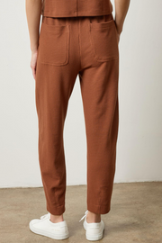 Praline waffle pants worn by a person on a plain background