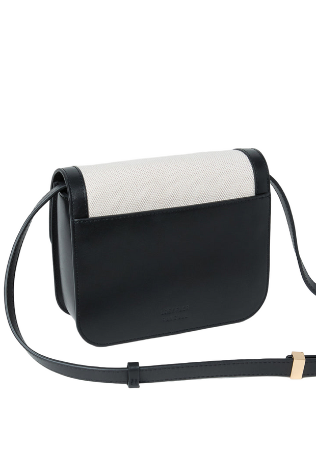 Black and white handbag on a light gray background