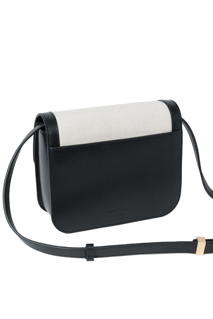 Black and white handbag on a light gray background