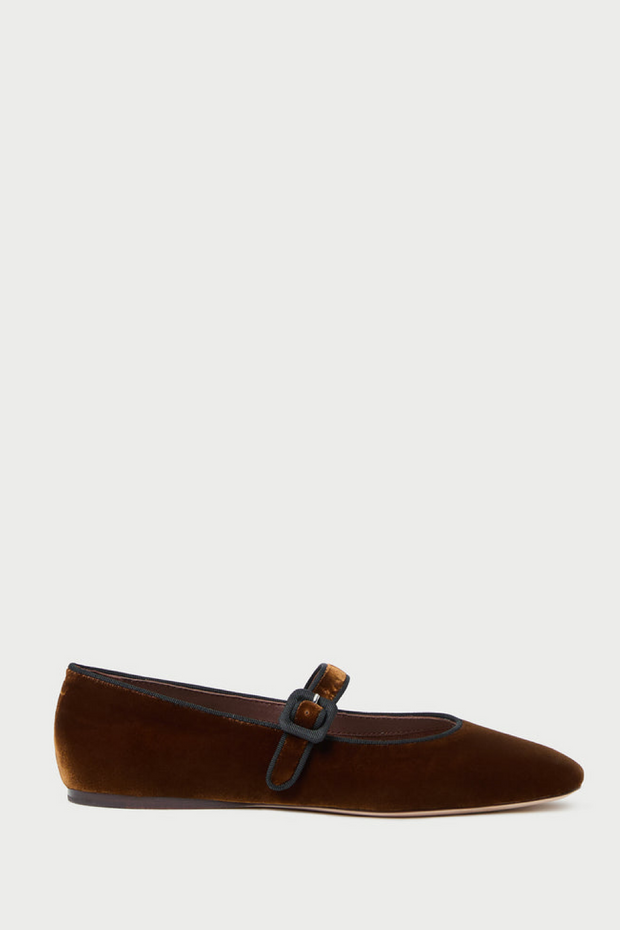 Brown velvet loafer with a decorative buckle on a white background
