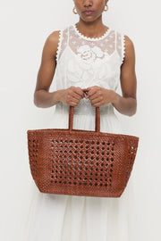 Image of model holding the Loeffler Randall Klara Woven Tote front view