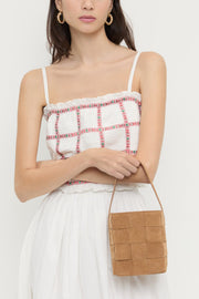 Image of the Loeffler Randall Laith Wide Woven Top Handle front view on model