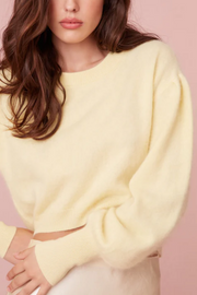 Image of model wearing Loveshackfancy Candela pullover 