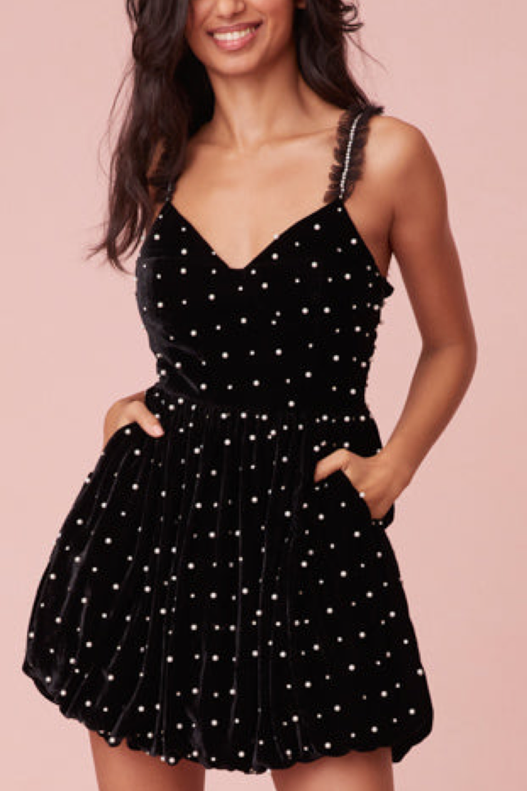 Image of model wearing Loveshackfancy Devita dress in black