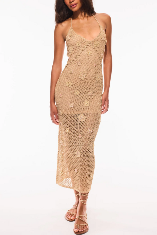 Woman wearing a beige lace dress on a white background
