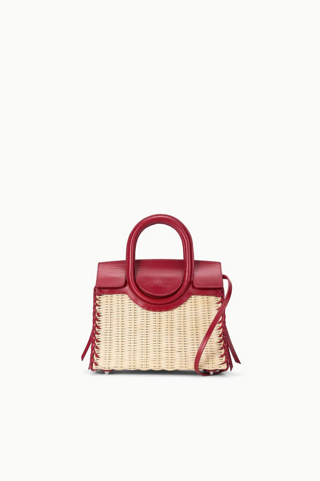 Red handbag with a woven design on a white background