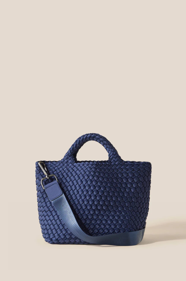 Blue woven handbag on a beige background
