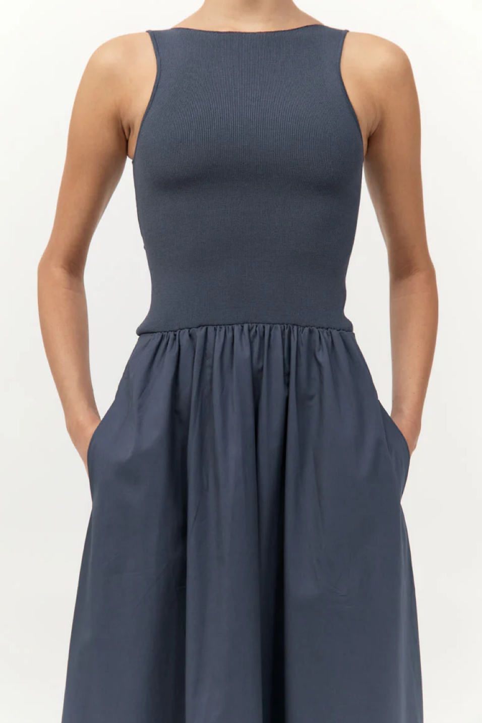 Navy blue sleeveless dress on a white background