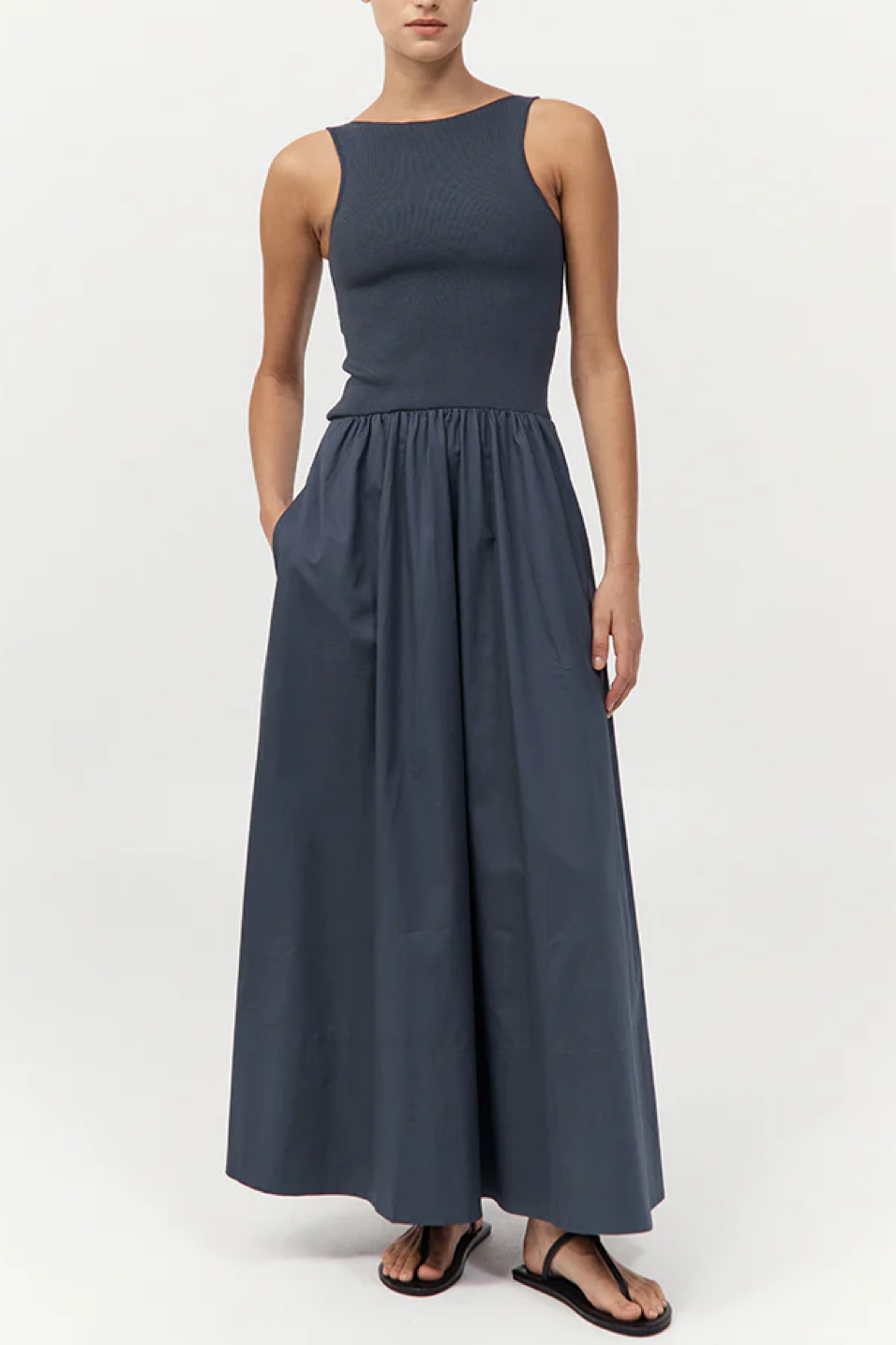 Woman wearing a long dress on a white background