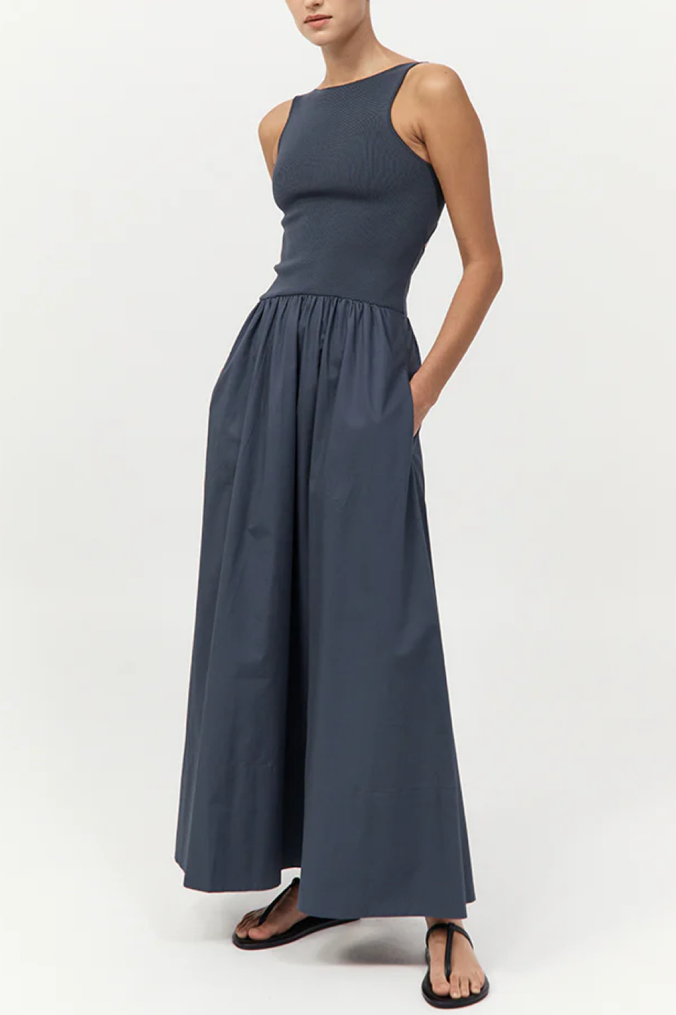 Woman wearing a long dress on a white background