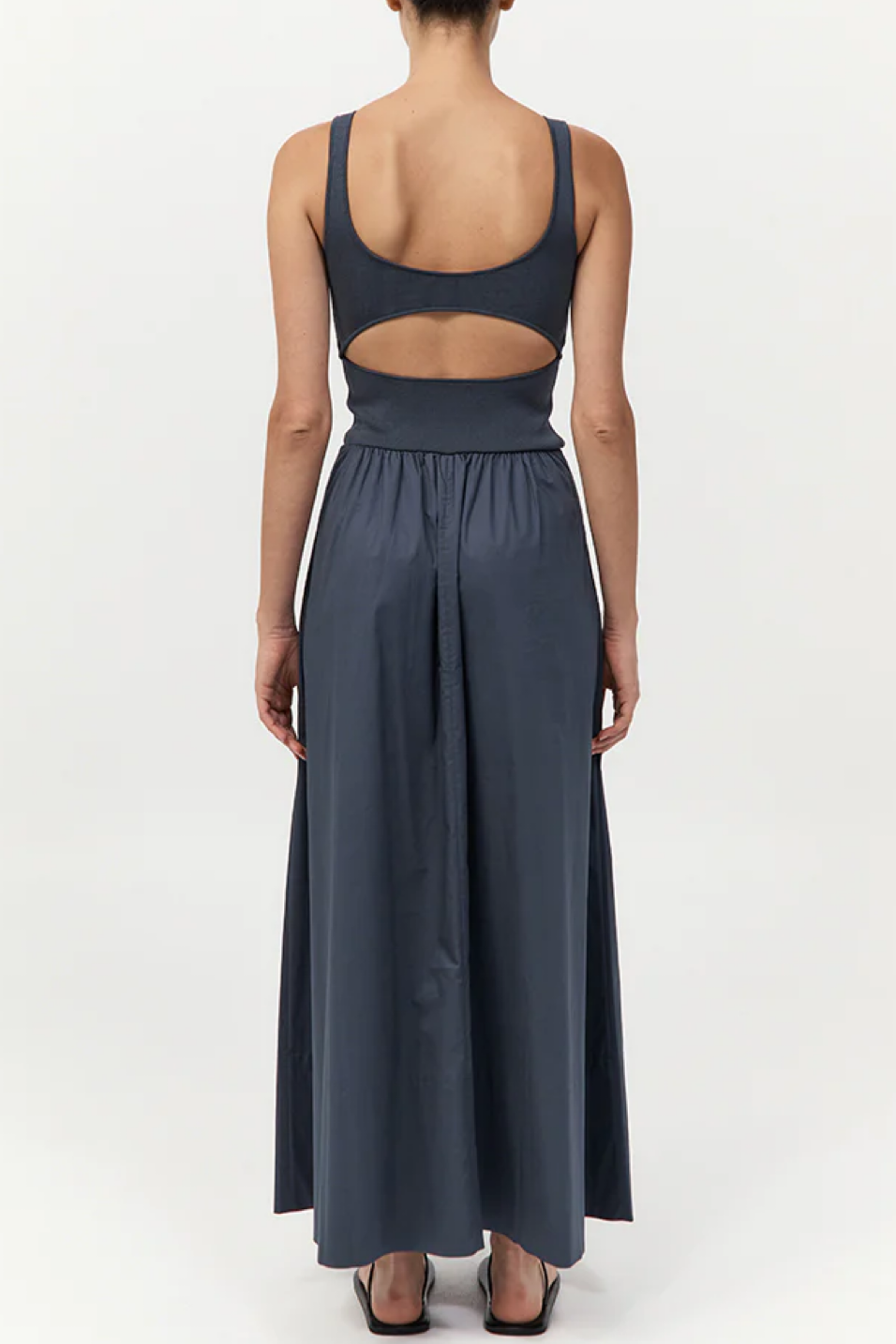 Dark gray dress with cut-out design on a white background