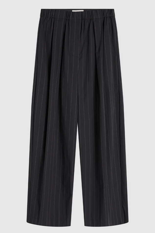 Pinstripe pants on a light gray background