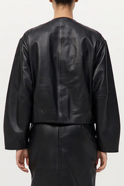 Black leather jacket worn by a person on a white background