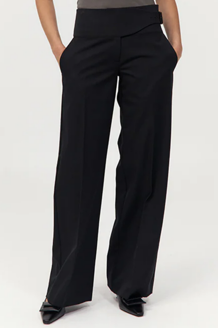 Black wide-leg pants worn by a person on a white background