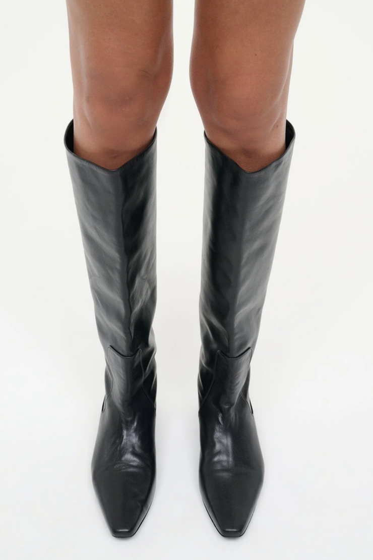 Black knee-high boots on a white background