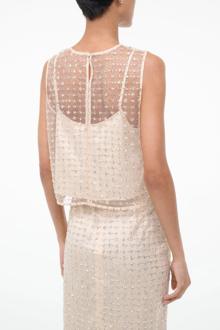 Two tone beaded top on a white background