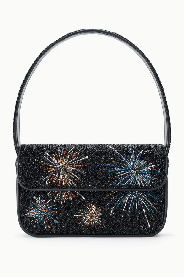 Black glitter handbag with colorful firework designs on a white background
