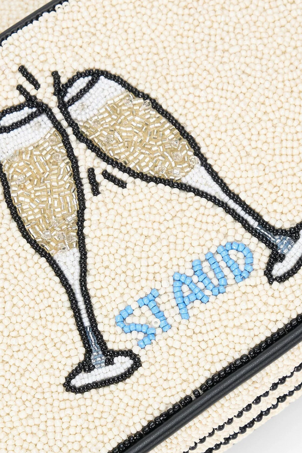 Beaded clutch with champagne glass design and 'ST AUD' text on a white background