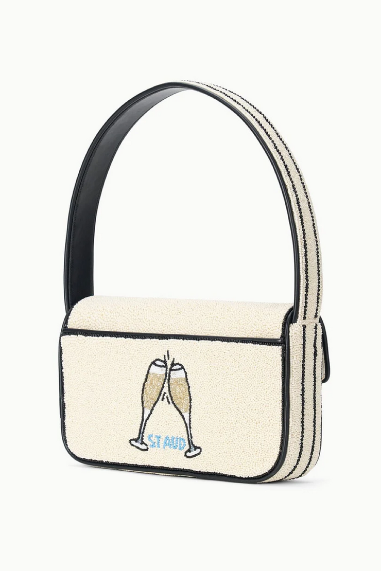 Small handbag with champagne glass design on a white background