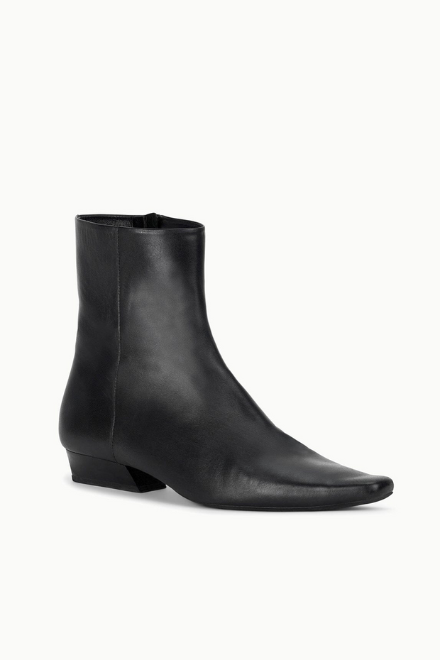Black ankle boot on a white background