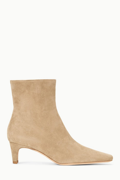 Beige ankle boot on a white background