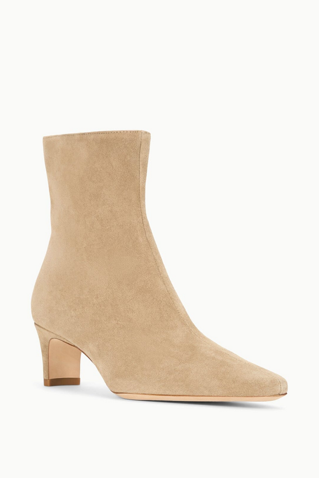 Beige ankle boot on a white background