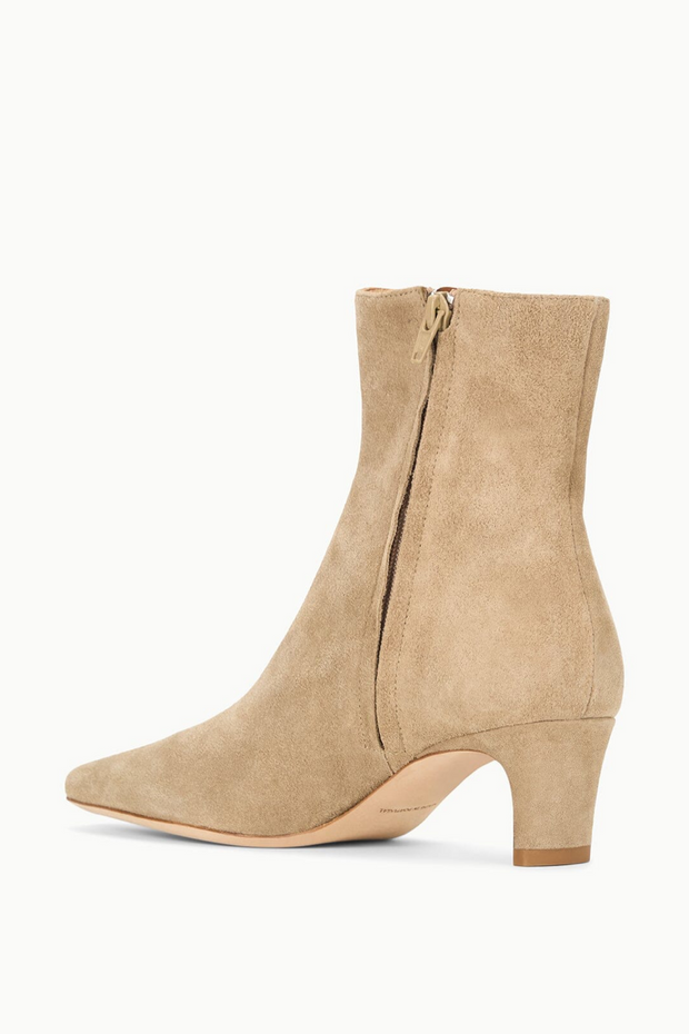 Beige suede ankle boot on a white background