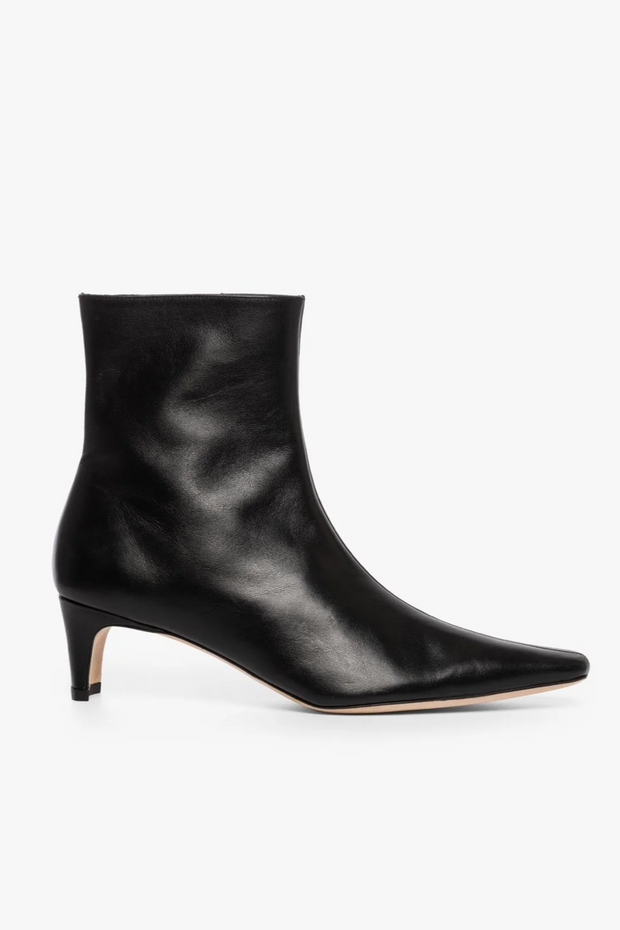 Black ankle boot on a white background