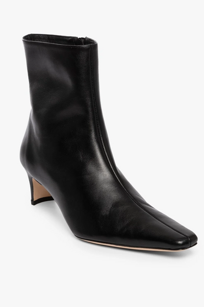 Black leather ankle boot on a white background