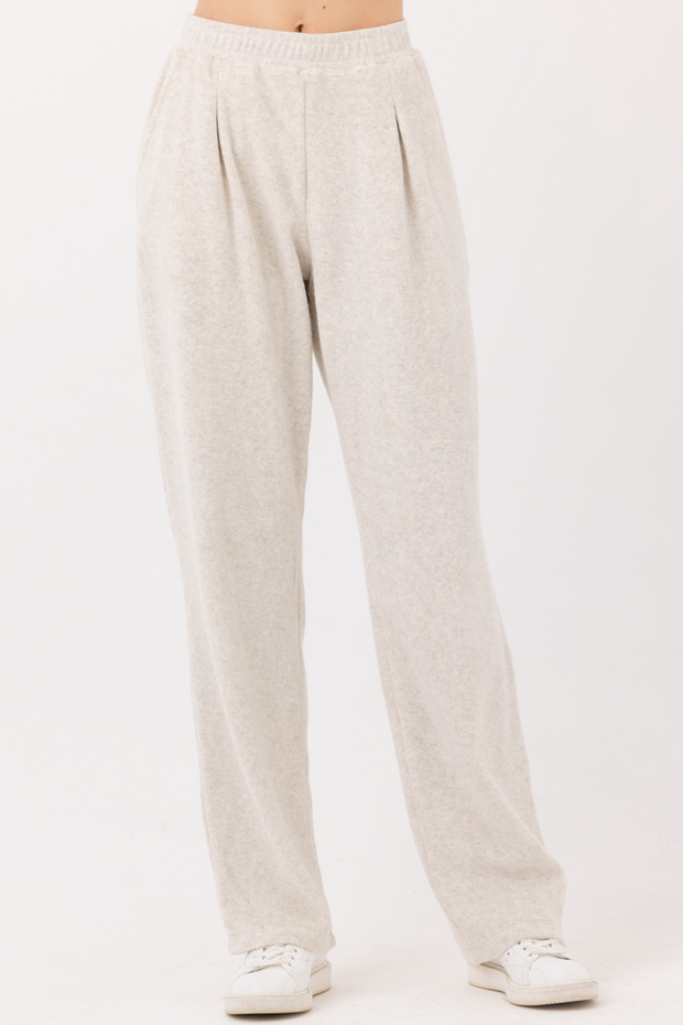Image of model wearing Sundays Italia pants in ash heather grey