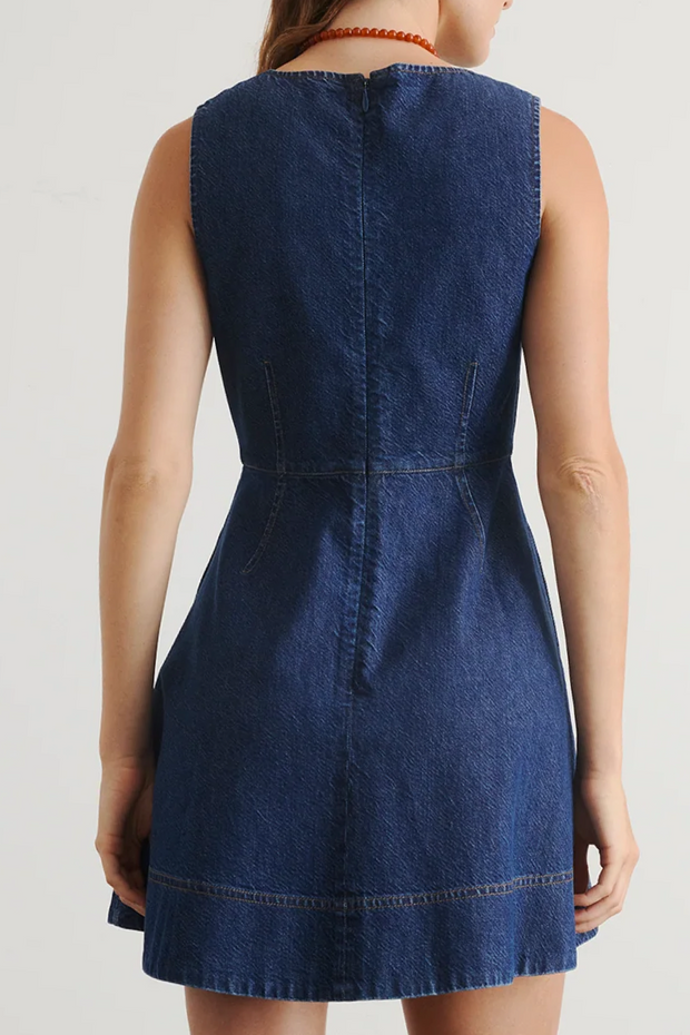 Blue denim dress on a plain background