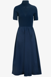 Navy blue dress with a high neckline on a white background