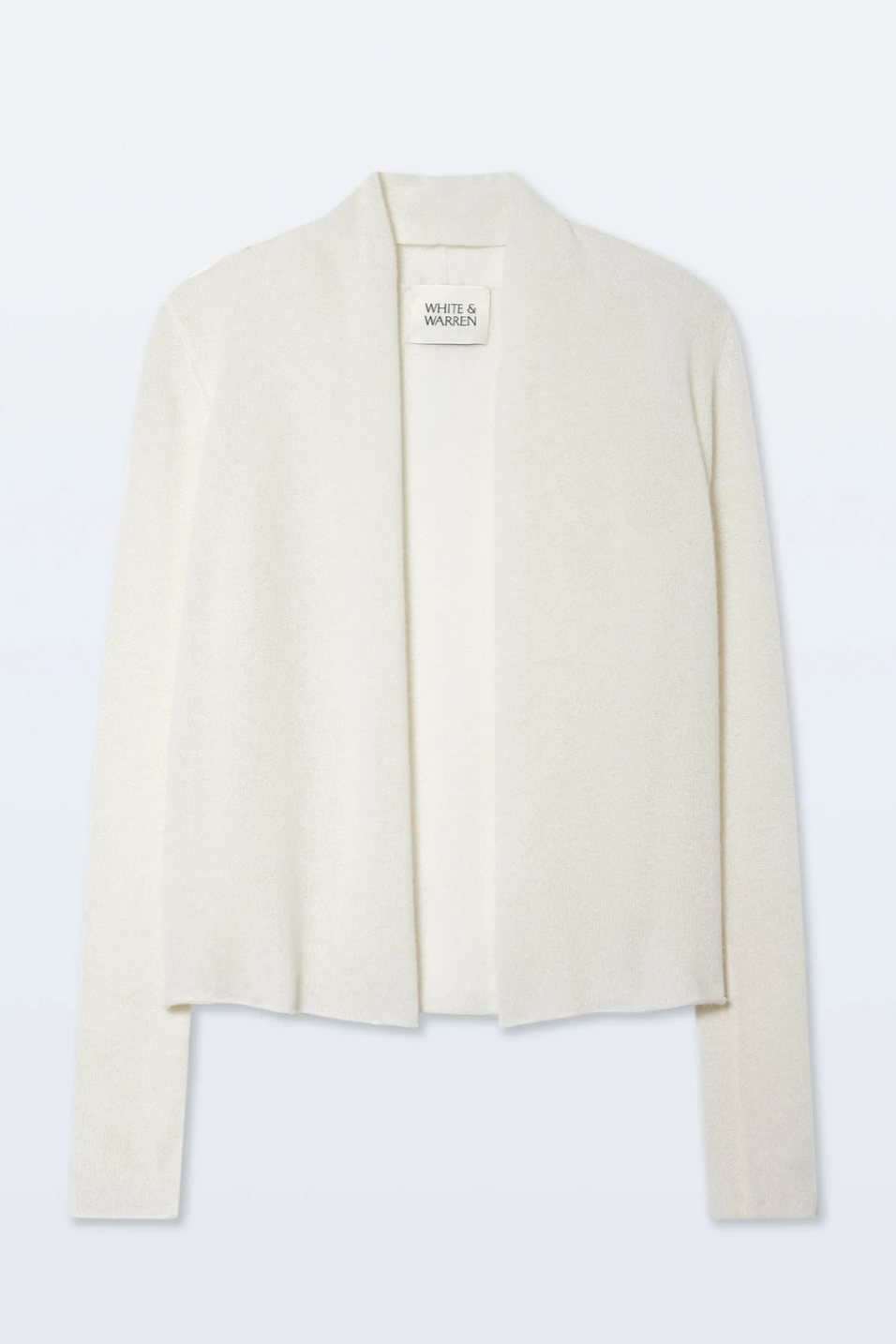 White blazer cardigan/trapeze on a light gray background