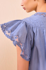 Image of model wearing the Ulla johnson Effie Flutter Sleeve Top back view