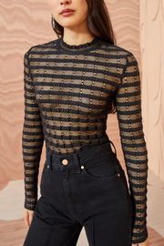 Image of model wearing Ullla Johnson Emma top in noir