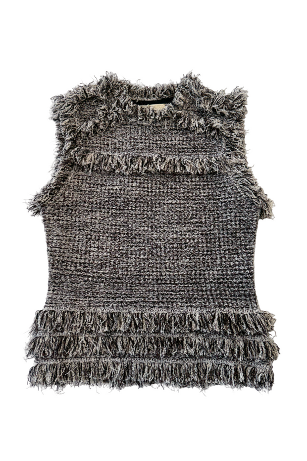 Tweed top against a white background