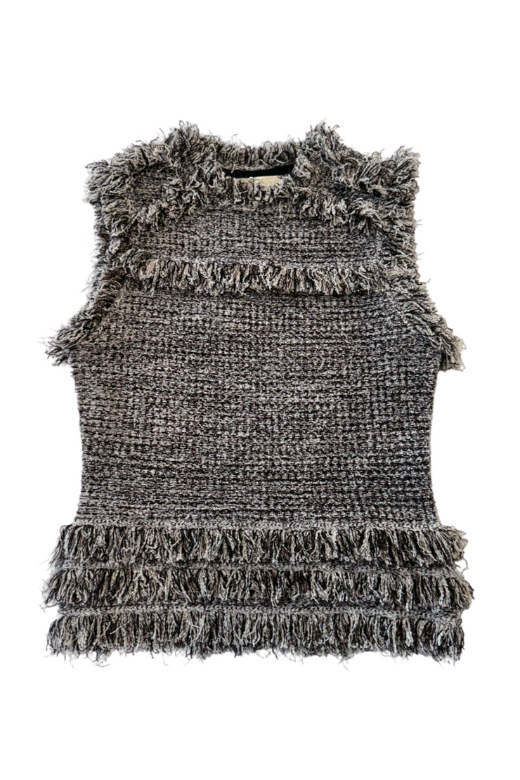 Tweed top against a white background