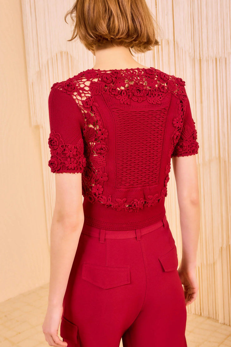 Image of model wearing the Ulla Johnson Stella Short Sleeve Knit Top back view