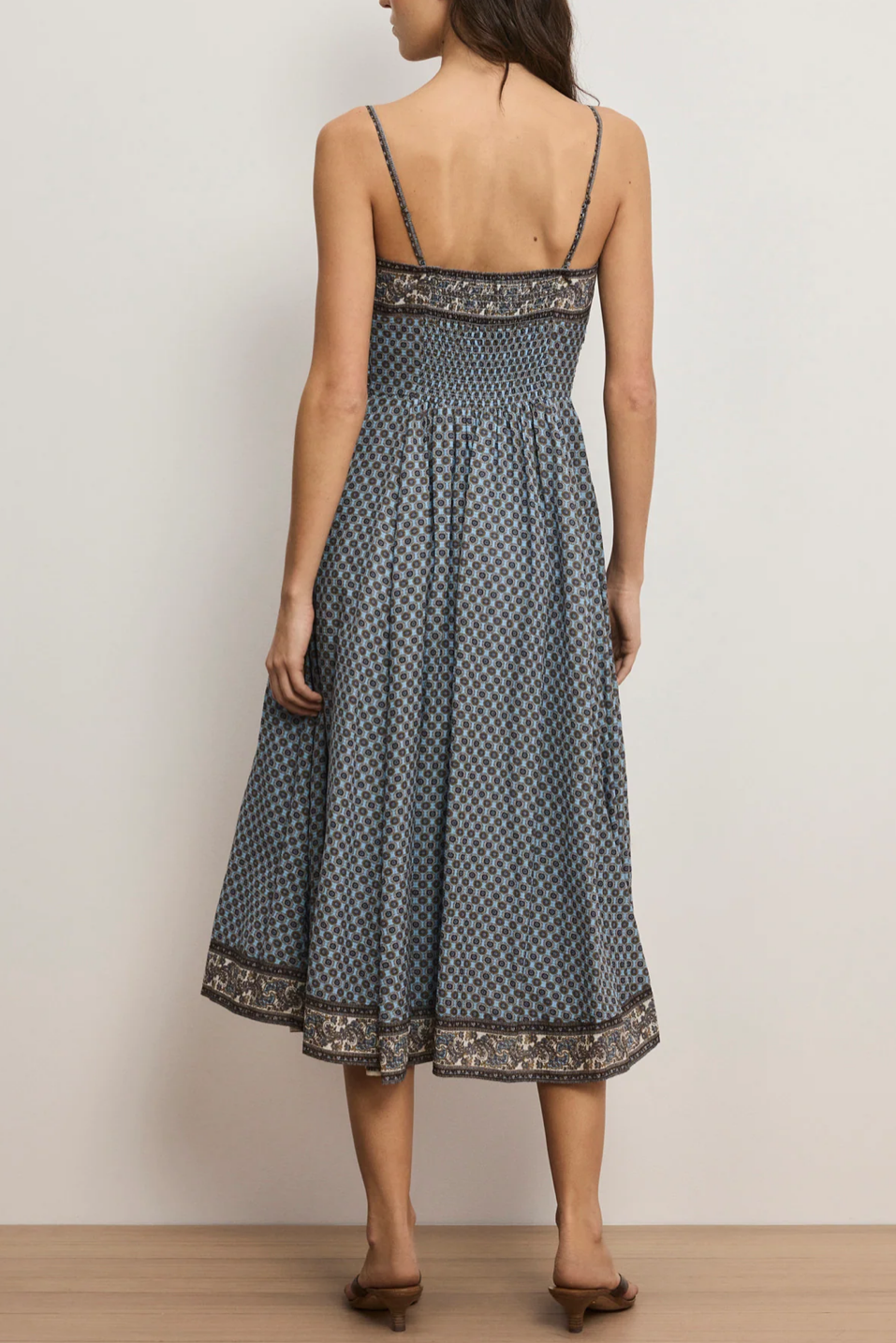 women wearing a blue midi dress with patterns 