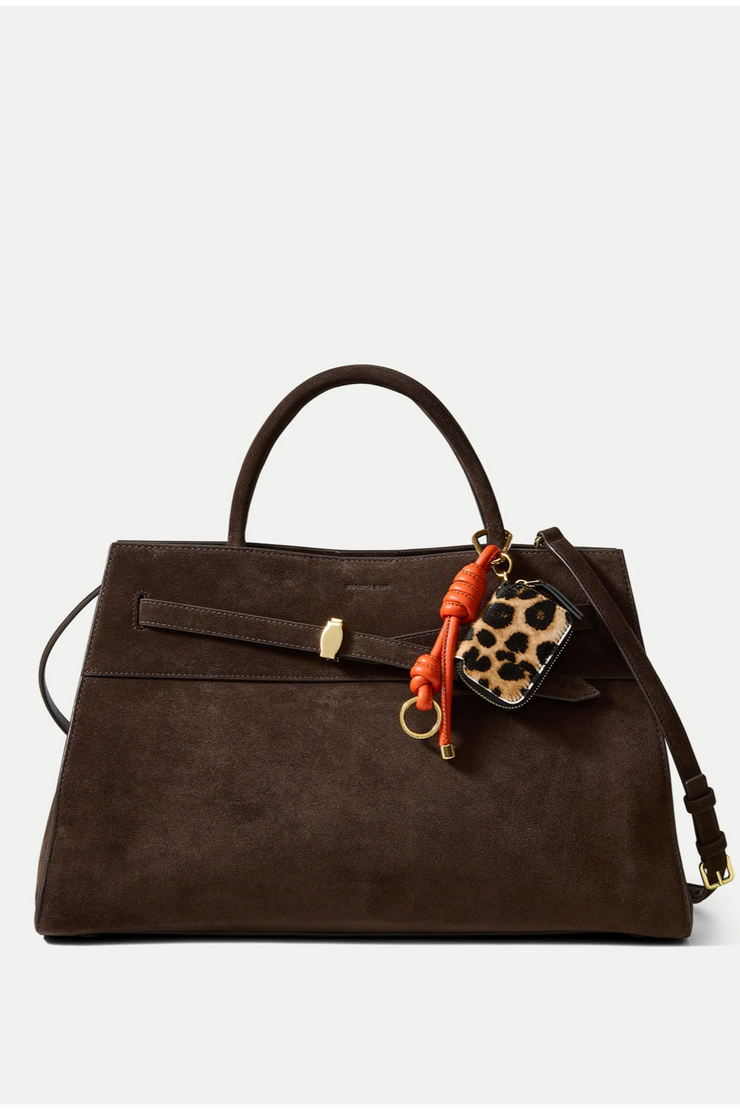 Brown handbag with a leopard print charm on a white background