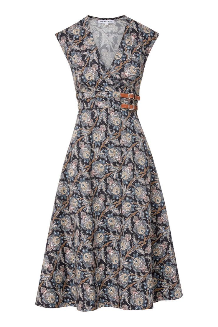 Floral patterned dress with a belt on a white background