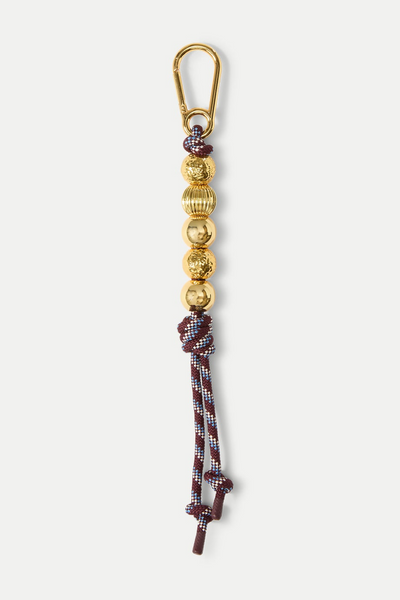Keychain with beads and braided design on a white background