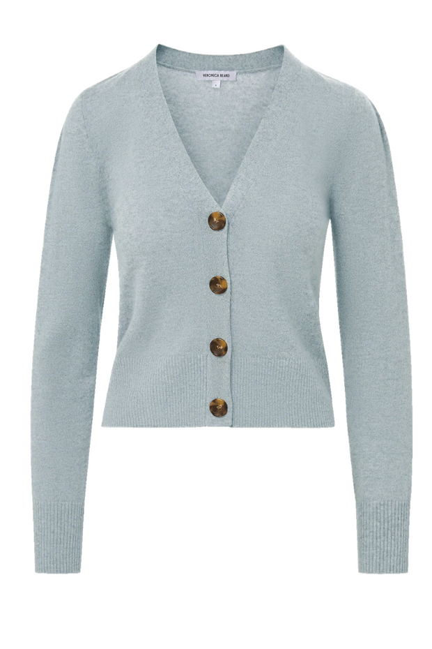 Light blue cardigan with brown buttons on a white background