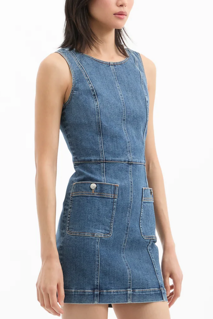 Blue denim dress worn by a model on a white background