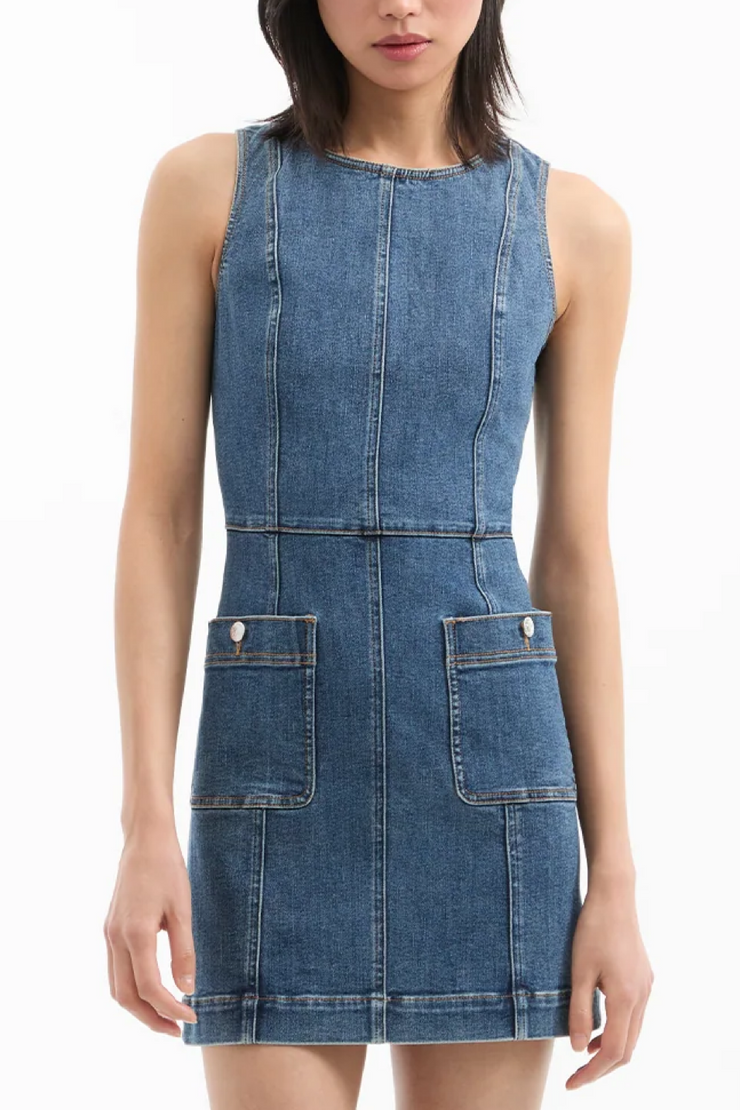 Denim dress worn by a model on a white background